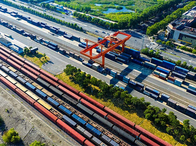 shipping container facility next to a highway